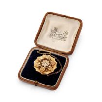 15ct gold brooch, in the form of a flower, with central diamond and locket reverse, with metal