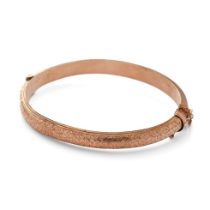 9ct rose gold hollow bangle with engraved decoration, 8.7 grams.