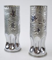 A Pair of WWI nickel plated trench-art shell cases. German with bird design. Dated 1915 / 1917.