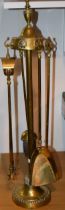 Victorian brass fire-side companion set with four original attachments. Height 62cm. In original