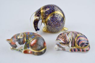 Royal Crown Derby paperweights to include a badger, a catnip kitten, both first quality with