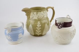 A group of three early 19th century moulded jugs, c. 1810-30. To include a Davenport feldspathic