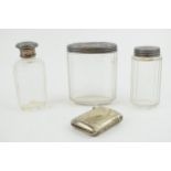 A collection of silver-topped Victorian bottles together with a silver plated vesta case. Weight