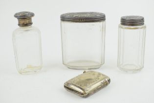 A collection of silver-topped Victorian bottles together with a silver plated vesta case. Weight