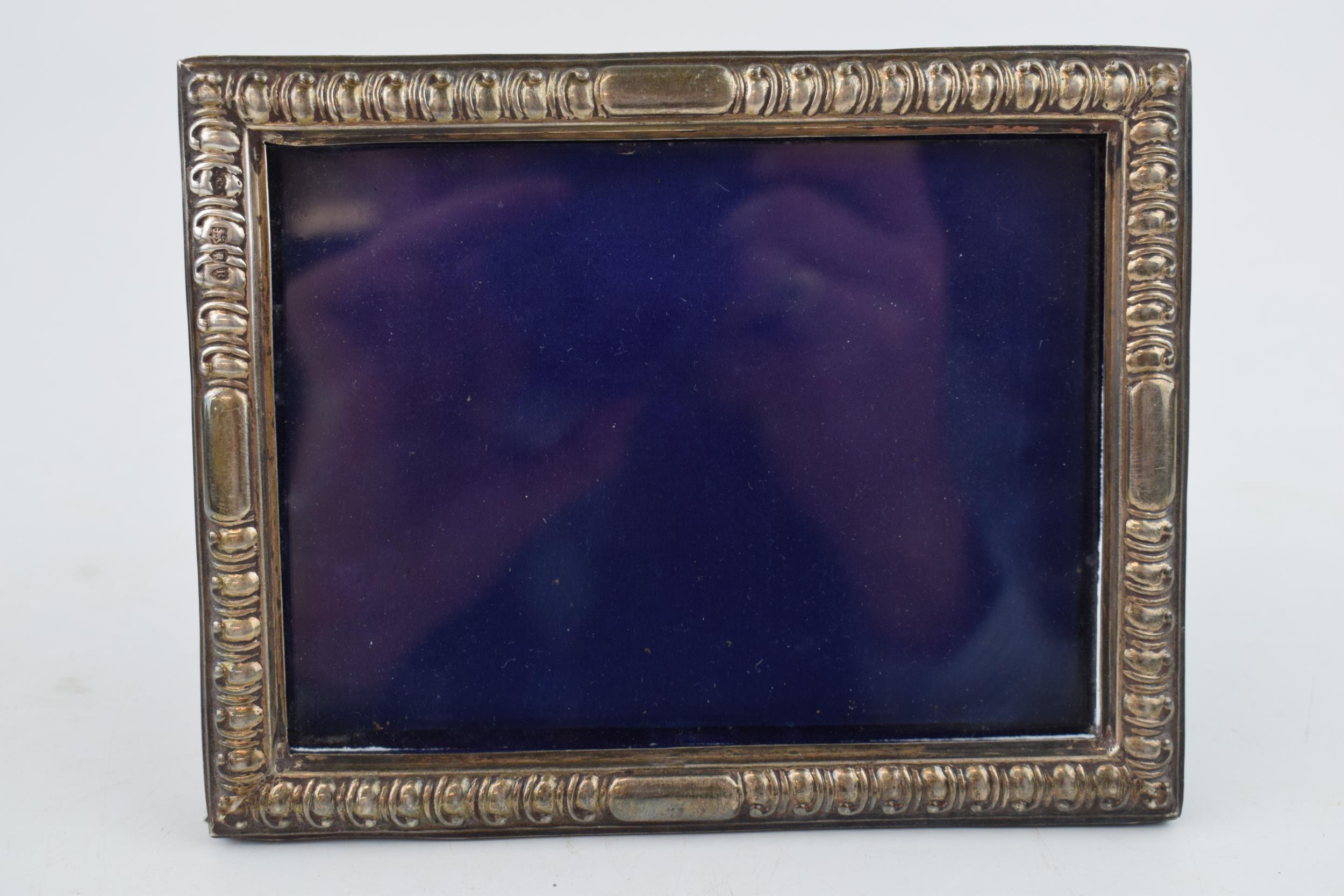 A silver photo frame, Hallmarked London 1892. With purple velvet back. Original stand and glass. - Image 2 of 4