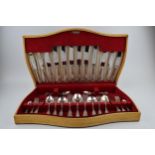 A wooden cased Flexeit stainless steel cutlery canteen, circa 62 pieces, to include serving