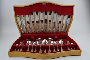 A wooden cased Flexeit stainless steel cutlery canteen, circa 62 pieces, to include serving