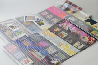 31 x UK presentation packs of stamps, together with additional sets and FDC (First Day Covers)