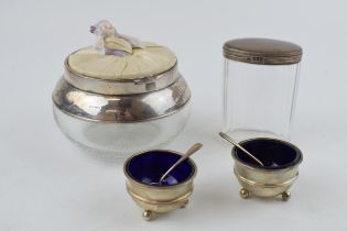 A pair of silver salts, hallmarked Birmingham 1907 / 1908 with matched spoons and Bristol blue glass