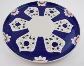 A large mid-19th century hand-painted charger with a geometric design, impressed FENTON, c. 1840.
