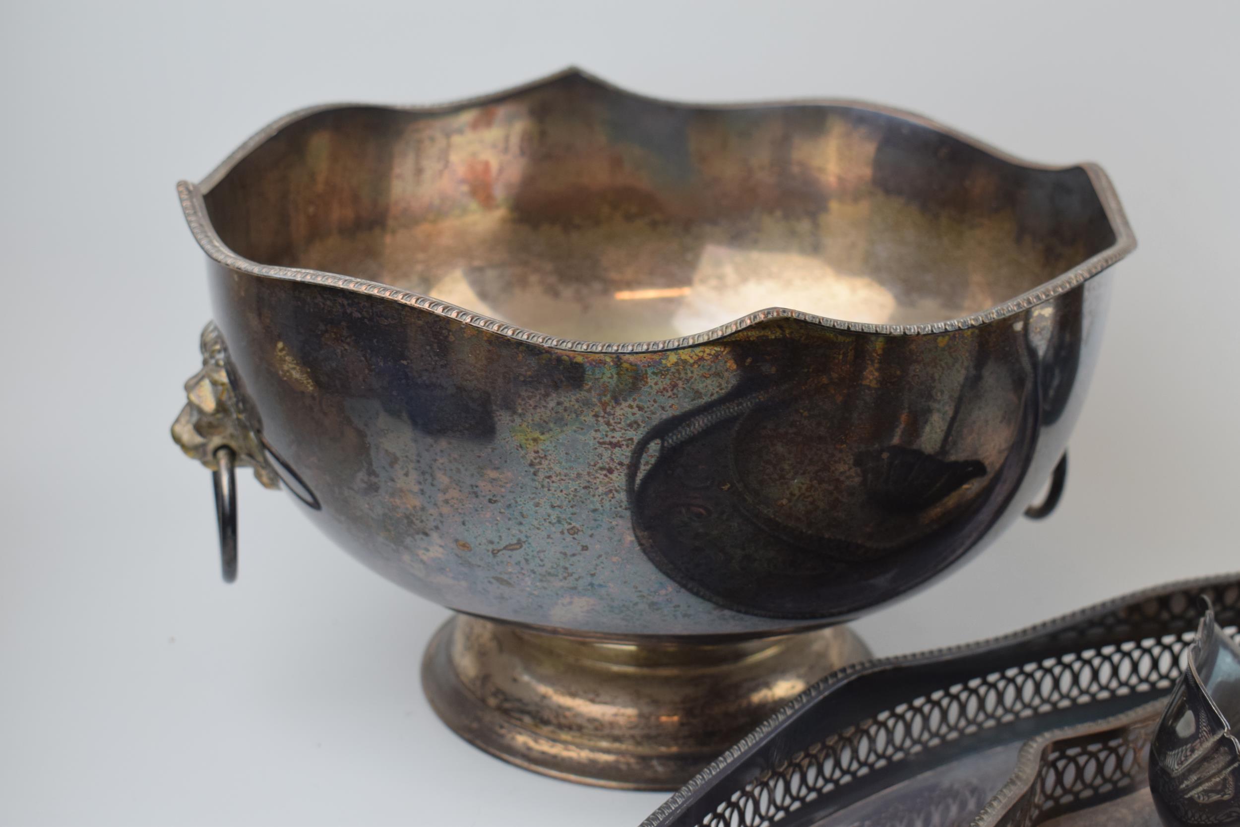 A collection of silver-plated items to include trays, an urn and a bowl, largest 27cm tall. In - Image 4 of 5