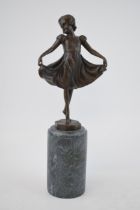 A spelter figure mounted onto a marble base in the form of a girl holding her dress, 32cm tall,