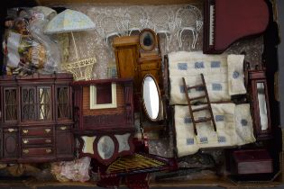 A good and interesting collection of dolls house furniture to include bedroom suites, people,