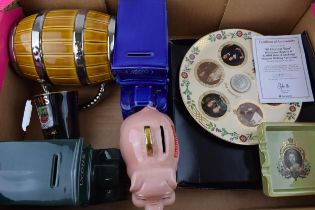 A collection of Wade pottery to include a Britannia piggy bank, a Lyons money box, a Boots Money