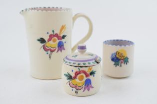 A group of Carter, Stabler and Adams and Poole Pottery pieces, c. 1930s. Including a milk jug by