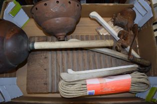 A collection of vintage items to include washing grabs, a wooden washing board, pegs, a washing