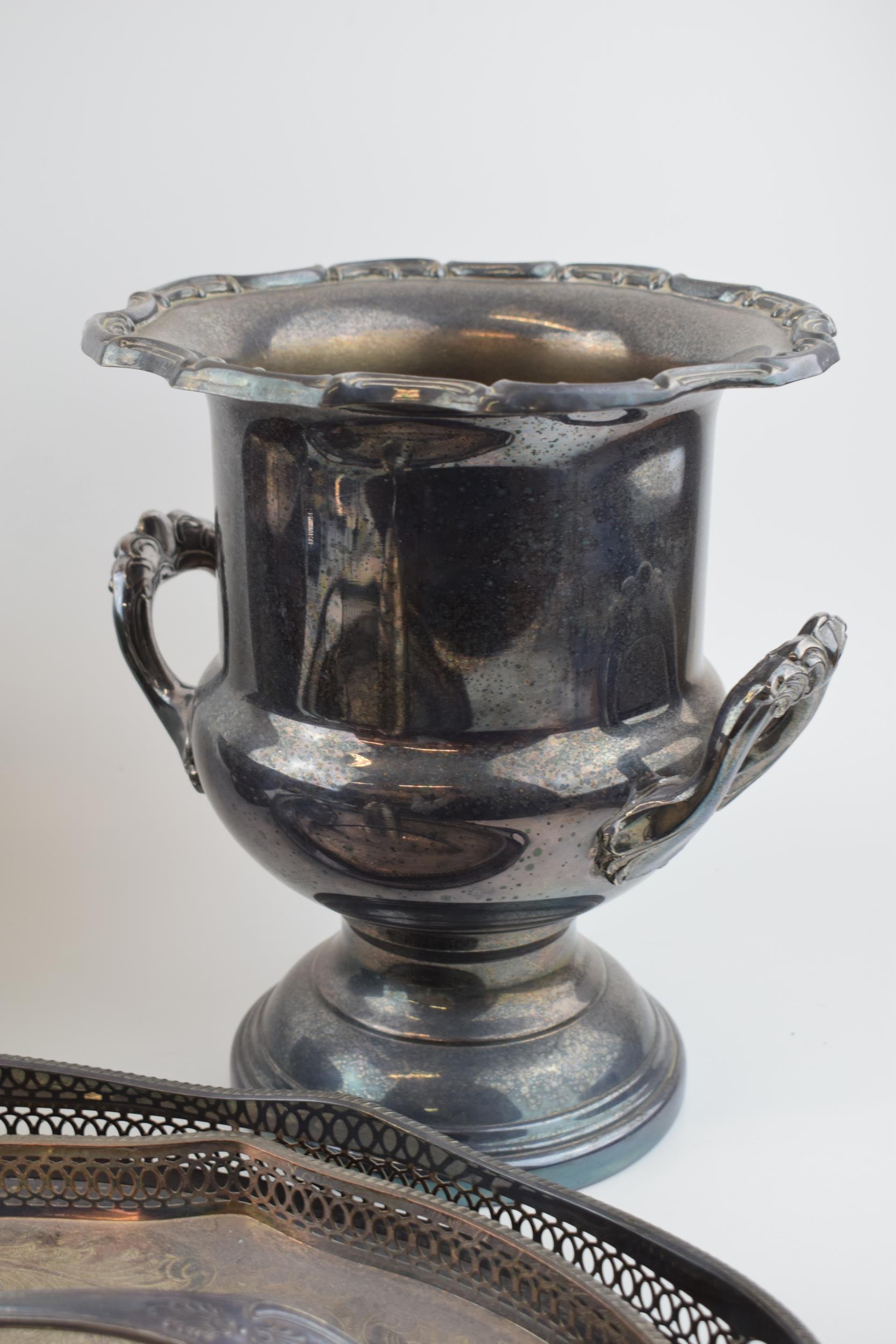 A collection of silver-plated items to include trays, an urn and a bowl, largest 27cm tall. In - Image 3 of 5