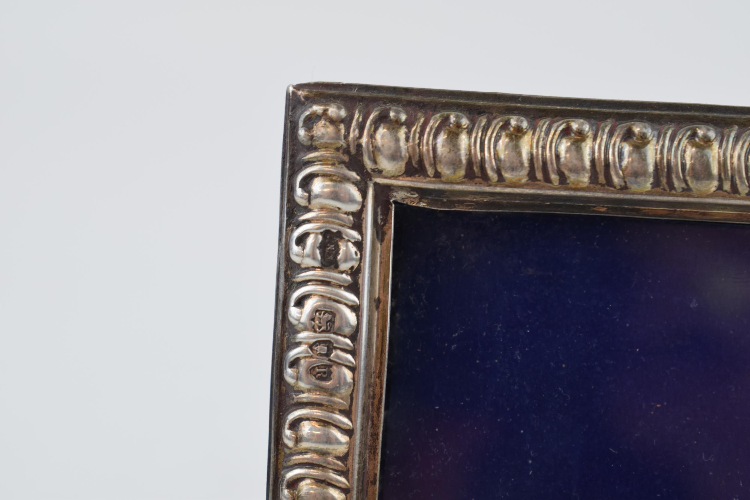 A silver photo frame, Hallmarked London 1892. With purple velvet back. Original stand and glass. - Image 3 of 4