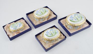 A set of four Royal Crown Derby Forget-Me-Not pattern graduated oval trinket dishes and covers,
