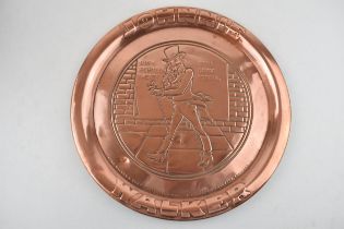 A copper advertising tray for Johnny Walker Whiskey, 'Born Eighteen Twenty, Still Going Strong'