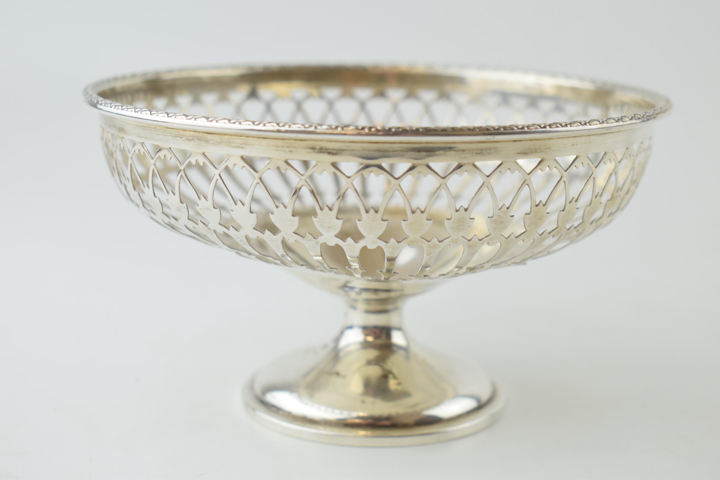 Silver pedestal bowl, London 1915, ornate decoration, 104.7 grams, 14cm diameter.