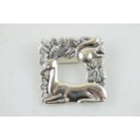 Sterling silver brooch, with stylized decoration, featuring a deer and a squirrel, 32mm wide.