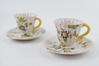 A pair of early 20th century Italian Cantagalli faience tin-glazed pottery cups and saucers, c.