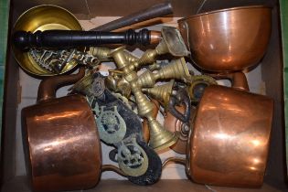 A mixed collection of brass and copper items to include two antique copper kettles, pans, horse