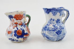 Two early 19th century Masons hydra jugs, c. 1825-40. One is blue-printed and the other is decorated