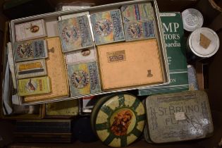 A good collection of vintage stamps, cigarette cards, cigarette packets, tins and other ephemera. (