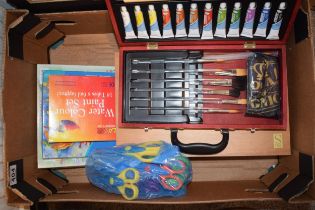 A collection of artist's equipment and materials to include NOS paints and brushes, watercolour