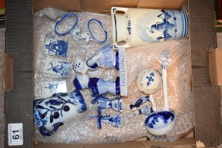A collection of Delft Pottery items to include two handled vase, egg with lid, miniature windmills