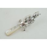 Sterling silver baby rattle, with mother of pearl, in the form of a Beatrix Potter style