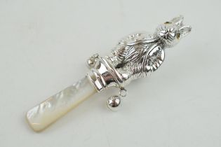 Sterling silver baby rattle, with mother of pearl, in the form of a Beatrix Potter style