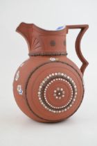 An early 19th century moulded stoneware terracotta G R Booth jug, c. 1839. It has hand-painted