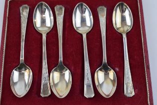 A boxed set of silver spoons hallmarked Sheffield 1935. In red velvet lined case. Weight 72 grams.