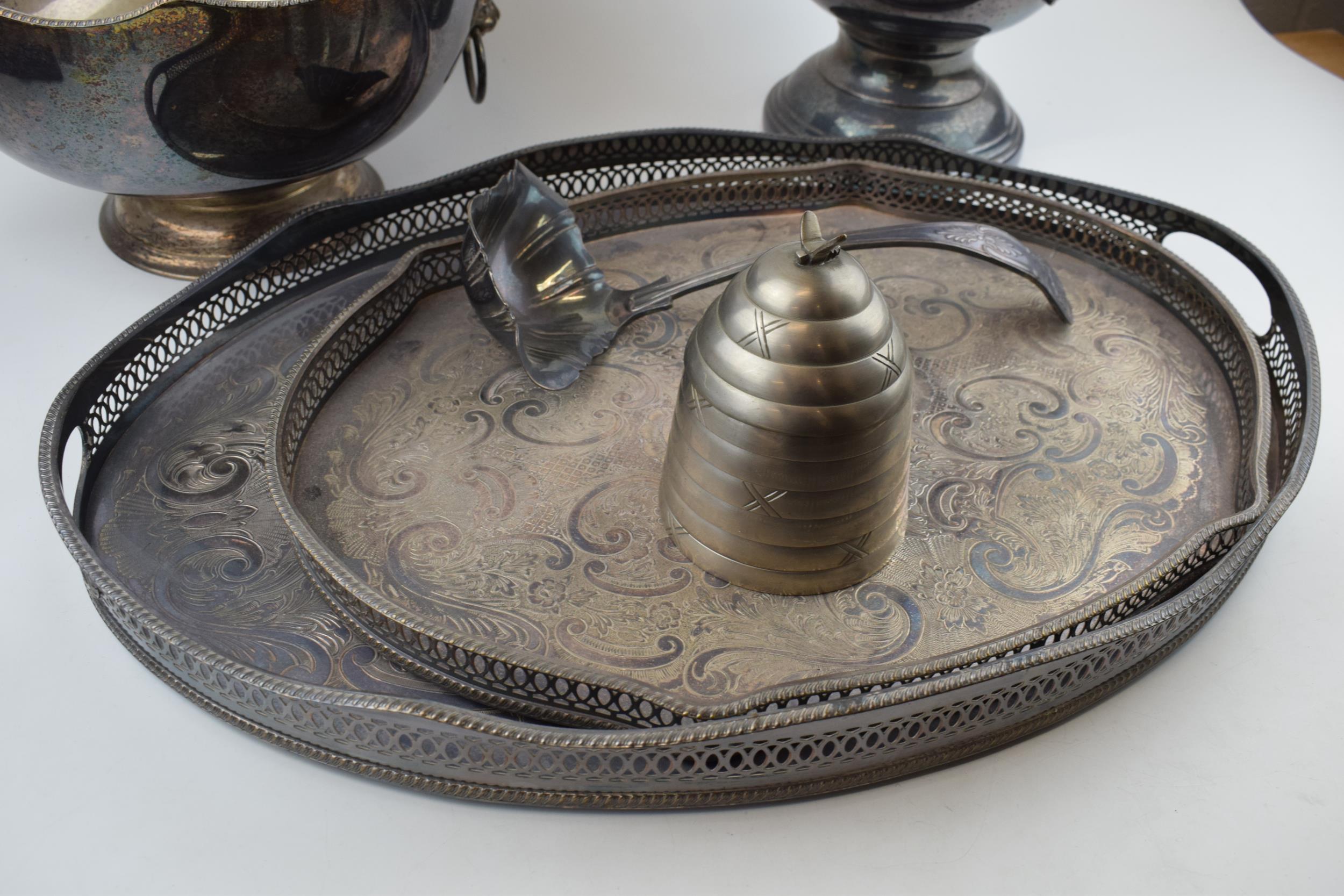 A collection of silver-plated items to include trays, an urn and a bowl, largest 27cm tall. In - Image 5 of 5
