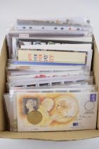 A collection of 37 First Day Covers with commemorative coins and medals, to include a 5 dollar coin,