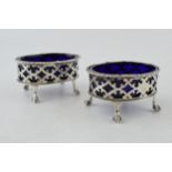 A pair of silver table salts, with blue glass liners, London 1900, 123.7 grams (2). Chips to one