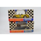 Two vintage boxed Tri-ang Scalextic cars, "Race Tuned" Sunbeam Tiger in yellow and "Race Tuned" Mini