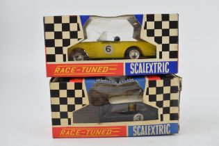 Two vintage boxed Tri-ang Scalextic cars, "Race Tuned" Sunbeam Tiger in yellow and "Race Tuned" Mini