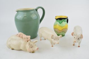 A collection of Beswick pigs to include 'Wall Queen','Wall Champion Boy' and another example with