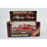 A boxed vintage Scalextric C.427 Red Porsche Turbo with working head and brake lights. Model in
