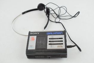 Vintage Sony Walkman stereo casette player WM-33, with headphones. In good condition though