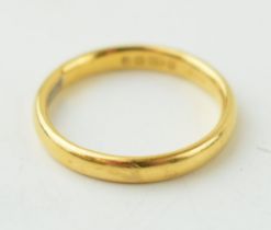A 22ct yellow gold wedding band hallmarked Birmingham. Weight 3.6 grams. In good usable condition.