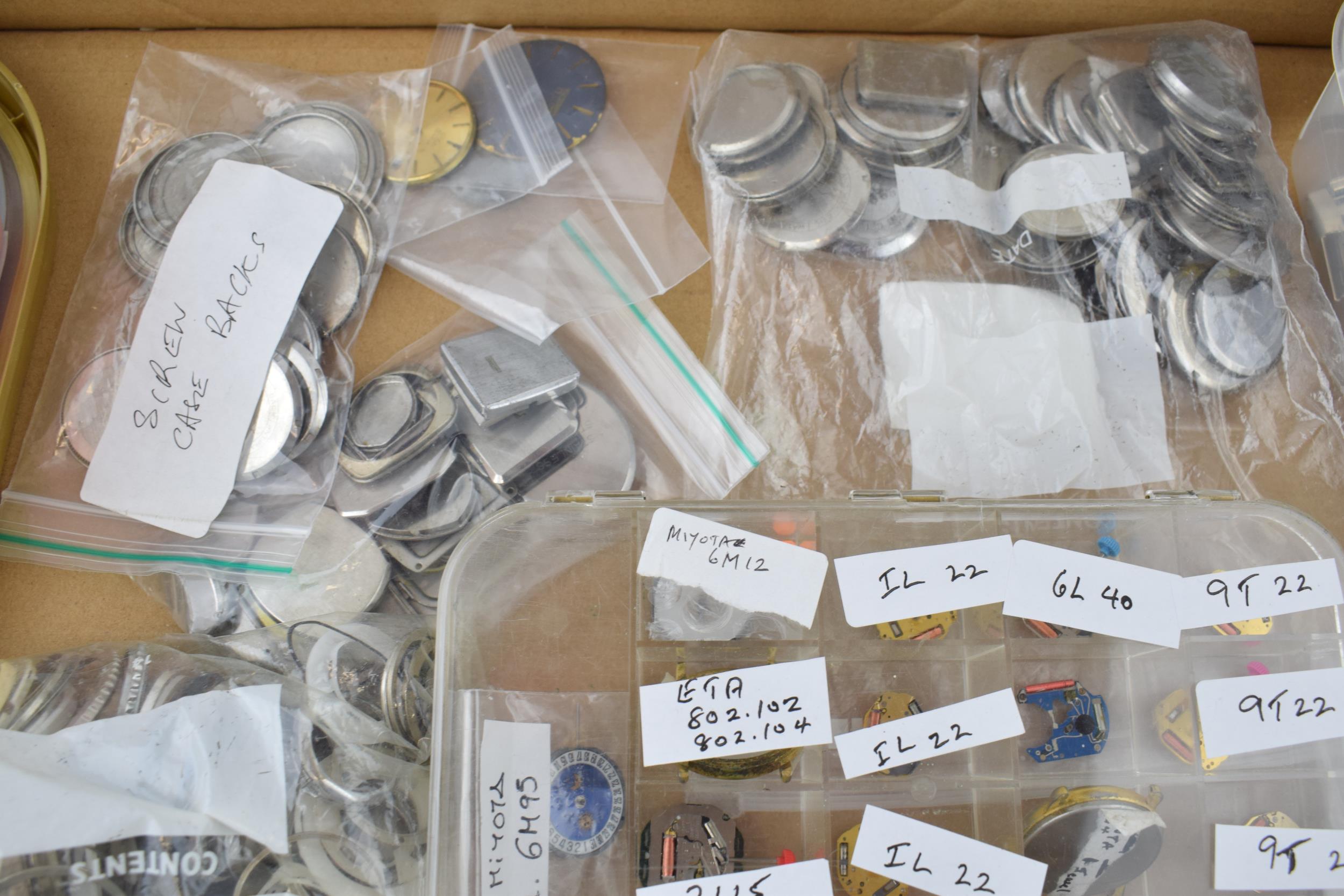 A large collection of watch parts to include bezels, quartz movements, watch backs and links. A good - Image 7 of 8