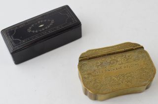 A pair of vintage snuff boxes to include a brass engraved example 'take a pinch and welcome' with an