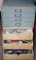 Two sets of drawers containing watch and lock parts to include NOS watch straps and bracelets,