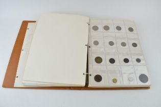 A collection of UK and foreign coinage housed in a collectors folder. Of note a 1921 silver