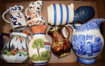 A collection of ceramic water jugs by Wedgwood. Mason's, Crown Devon and other similar